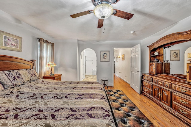 bedroom with ceiling fan and light hardwood / wood-style floors