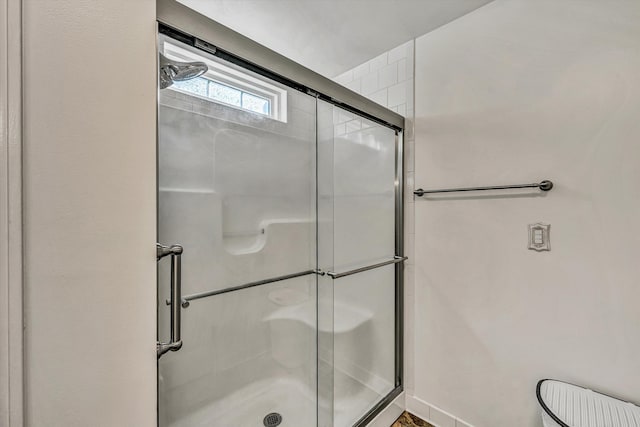 bathroom featuring walk in shower