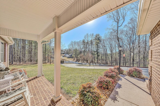 view of yard with covered porch