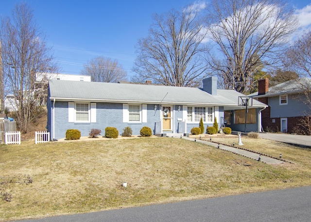 ranch-style home with a front lawn