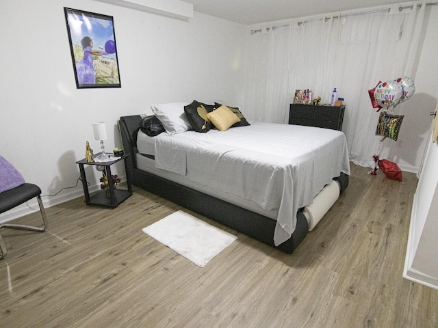 bedroom featuring light hardwood / wood-style floors