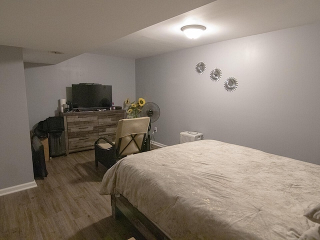 bedroom featuring wood-type flooring