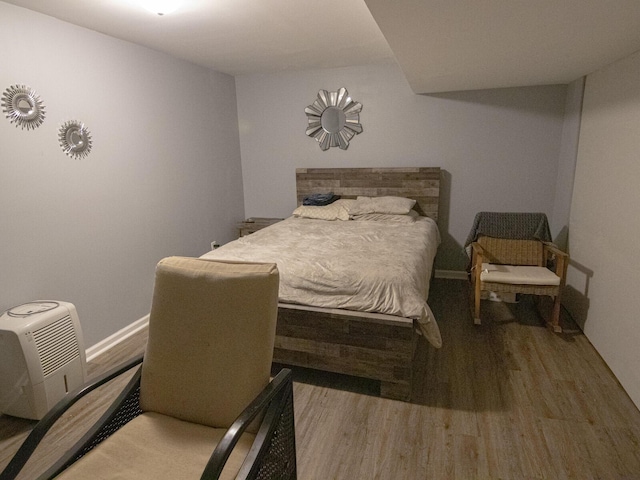 bedroom with wood-type flooring