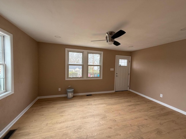 foyer featuring ceiling fan and light hardwood / wood-style floors