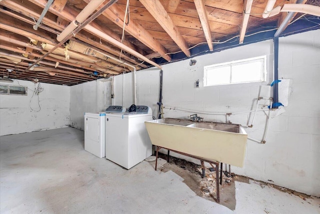 below grade area with washing machine and dryer and a sink