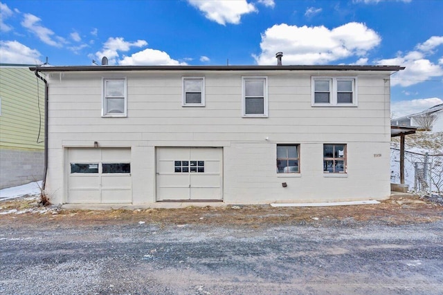 view of side of home with a garage