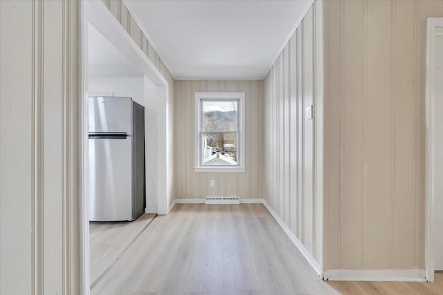 interior space with light wood-style floors and baseboards