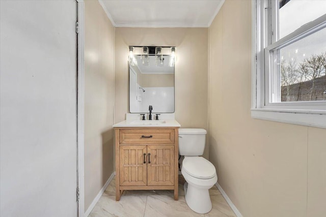 half bath featuring toilet, vanity, baseboards, marble finish floor, and ornamental molding