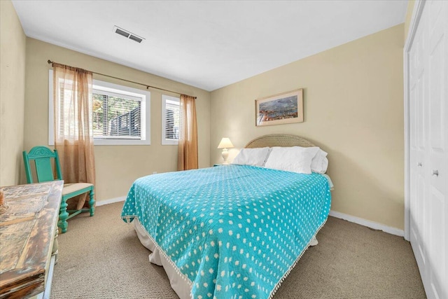 bedroom featuring light carpet