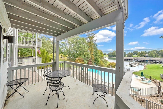 view of patio with a water view