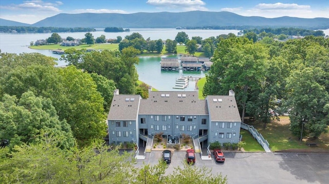 drone / aerial view with a water and mountain view