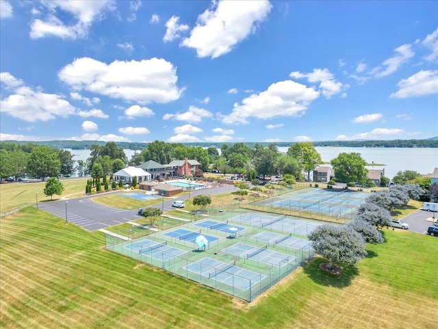 birds eye view of property with a water view