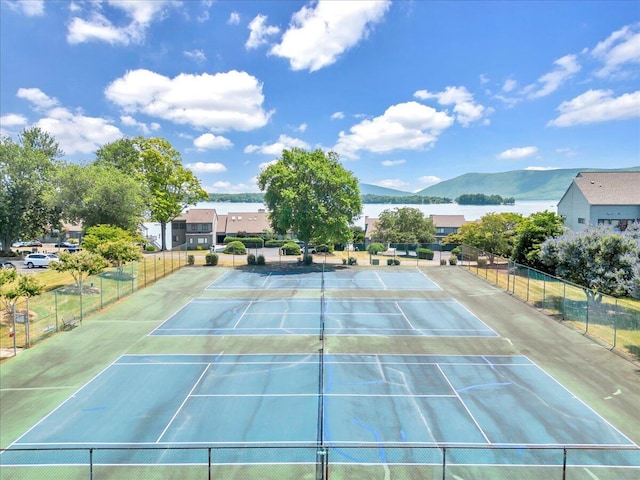 view of tennis court with a mountain view