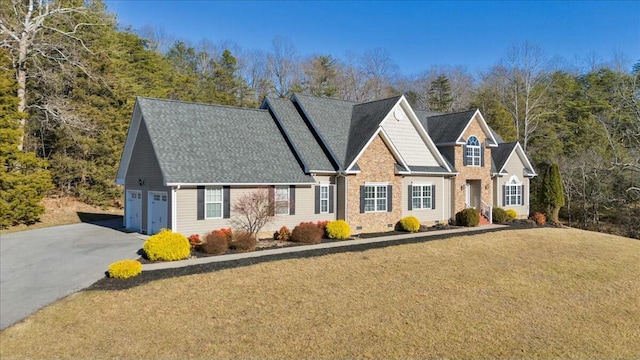 front of property featuring a garage and a front lawn