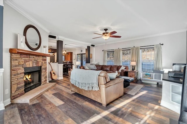 living room featuring crown molding, a fireplace, and dark hardwood / wood-style flooring