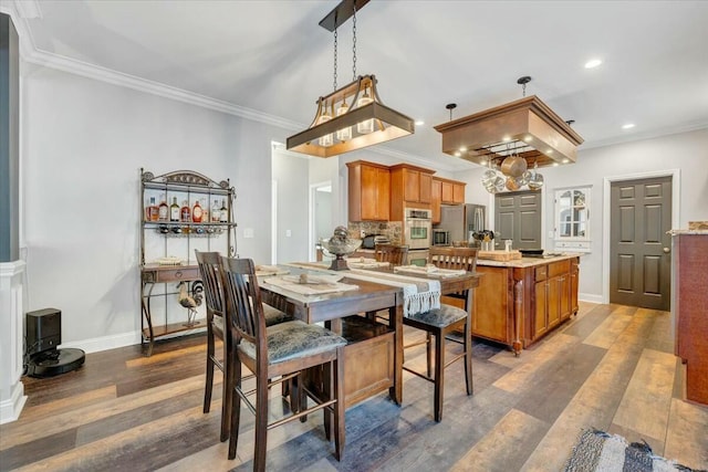 dining room featuring crown molding and dark hardwood / wood-style flooring