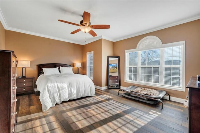 bedroom with crown molding, ceiling fan, and dark hardwood / wood-style flooring