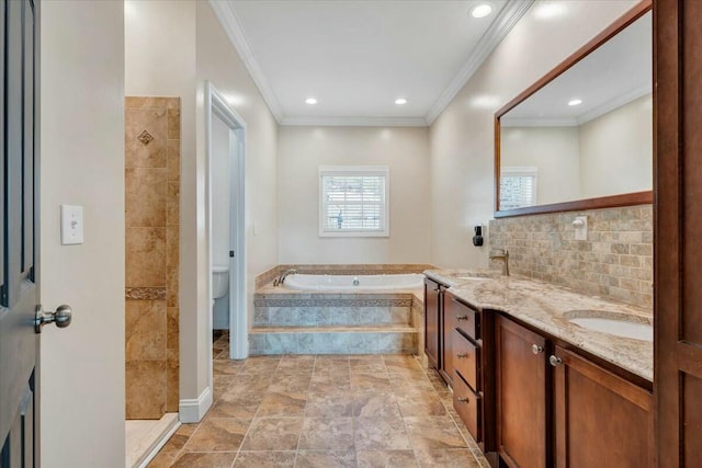 full bathroom with toilet, crown molding, tasteful backsplash, vanity, and plus walk in shower