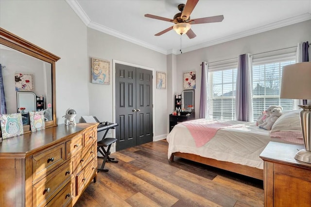 bedroom with crown molding, ceiling fan, dark hardwood / wood-style flooring, and a closet