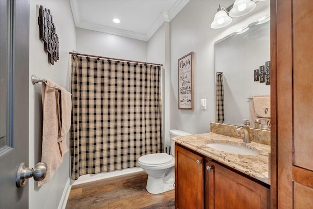 bathroom featuring crown molding, vanity, toilet, and hardwood / wood-style floors