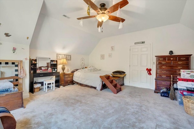 bedroom with ceiling fan, light colored carpet, and lofted ceiling