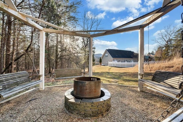 view of yard featuring an outdoor fire pit