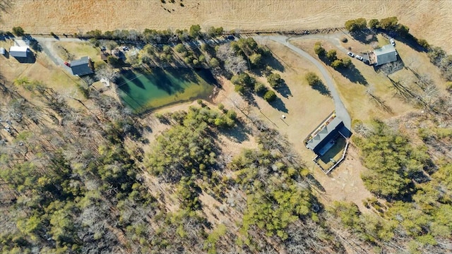 birds eye view of property featuring a water view and a rural view