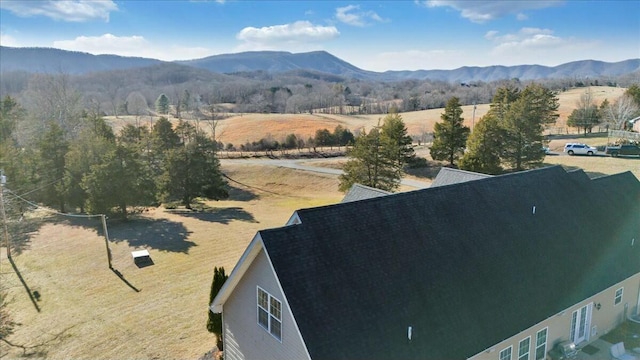 birds eye view of property with a mountain view