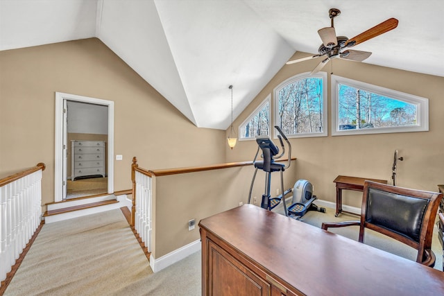office with baseboards, ceiling fan, vaulted ceiling, and light colored carpet