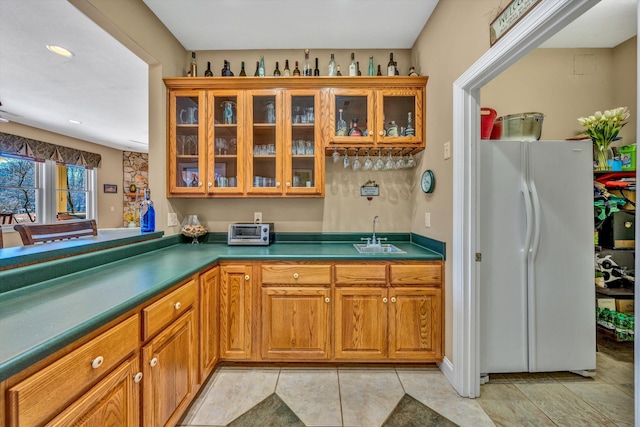 bar with freestanding refrigerator, a toaster, recessed lighting, a sink, and wet bar