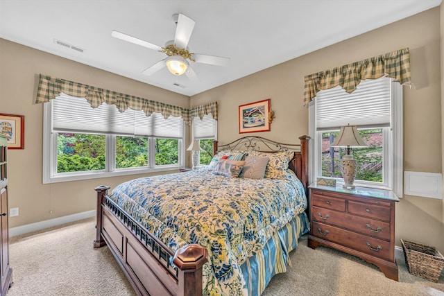 bedroom featuring carpet floors, baseboards, ceiling fan, and visible vents