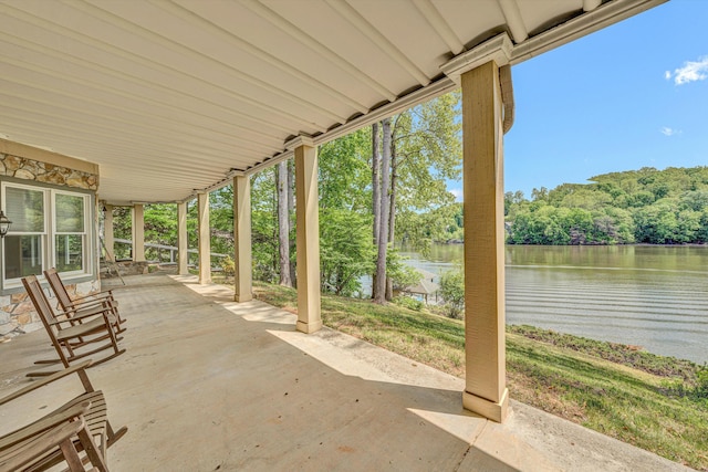 view of patio with a water view