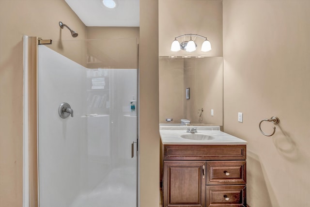 bathroom with vanity and a shower stall