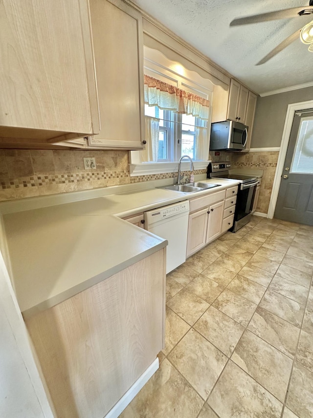 kitchen with light brown cabinetry, sink, a textured ceiling, ornamental molding, and stainless steel appliances