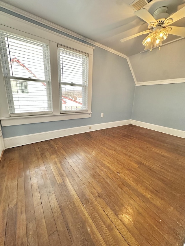 additional living space with wood-type flooring, ceiling fan, and vaulted ceiling