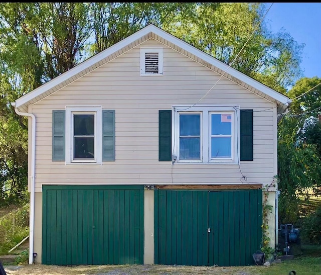 view of property exterior with a garage