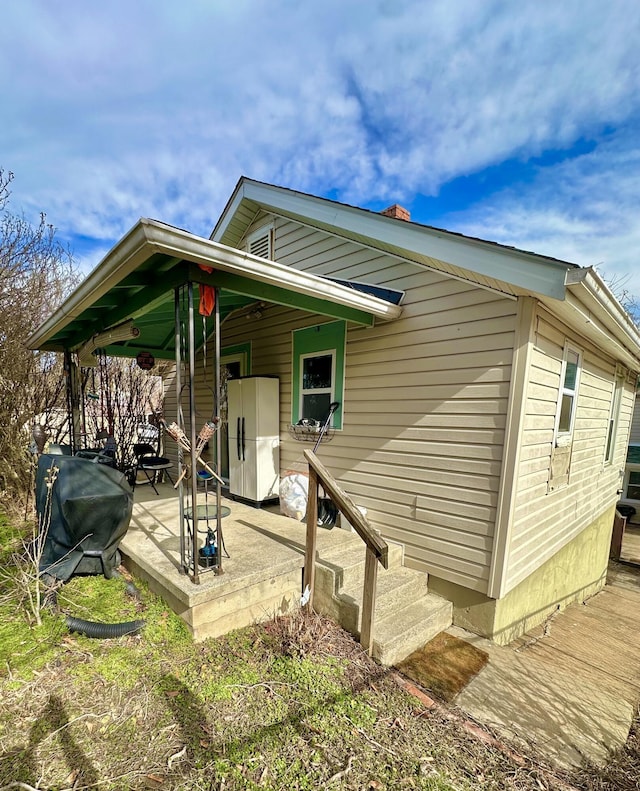 back of property with a wooden deck