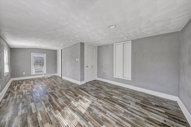 spare room featuring dark wood-type flooring