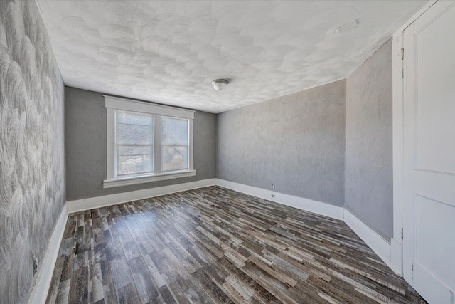 spare room with dark wood-type flooring