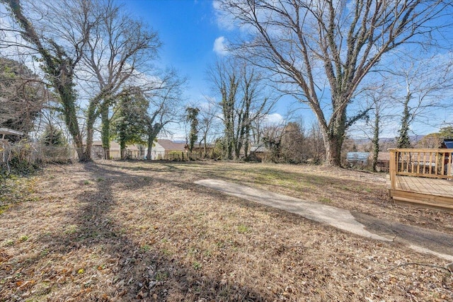 view of yard with a wooden deck