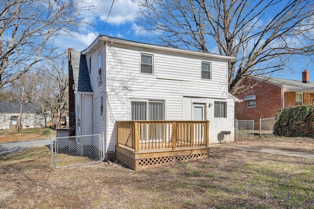 back of house with a wooden deck