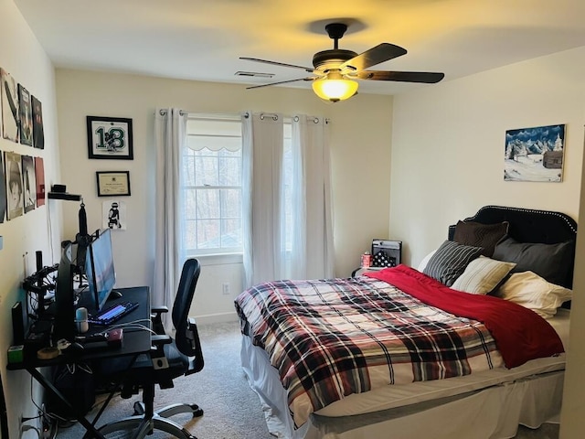 bedroom with carpet flooring, ceiling fan, and visible vents