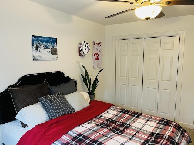 bedroom featuring carpet, ceiling fan, and a closet