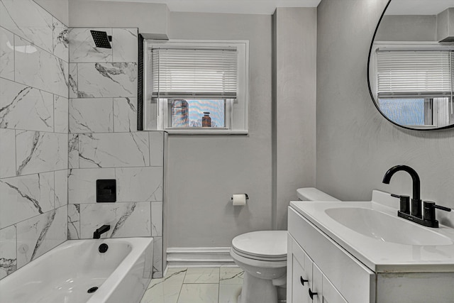 full bathroom with vanity, toilet, and tiled shower / bath