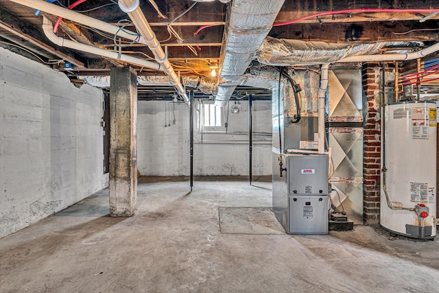 basement featuring heating unit and gas water heater