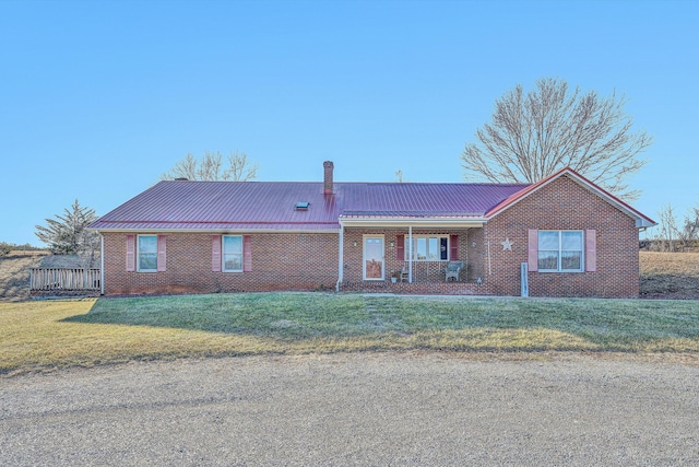 ranch-style house with a front lawn