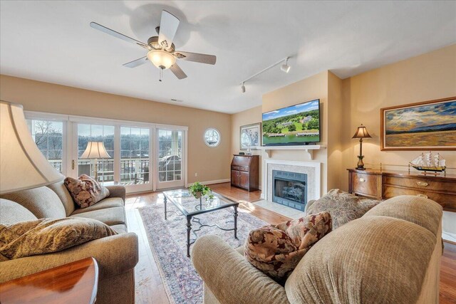 deck with french doors, ceiling fan, and a grill