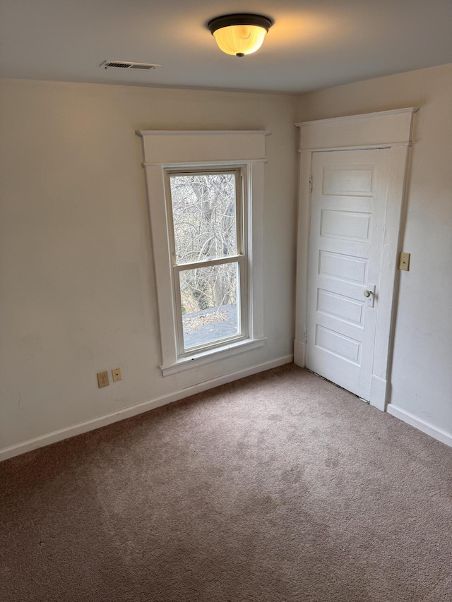 empty room featuring carpet floors