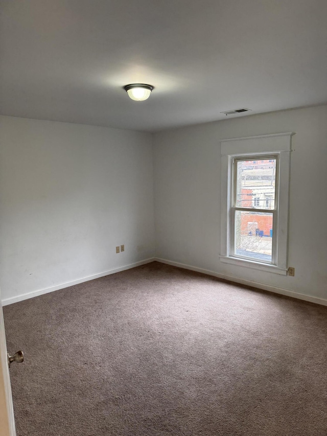 empty room featuring carpet flooring