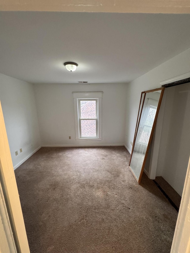 unfurnished bedroom featuring carpet